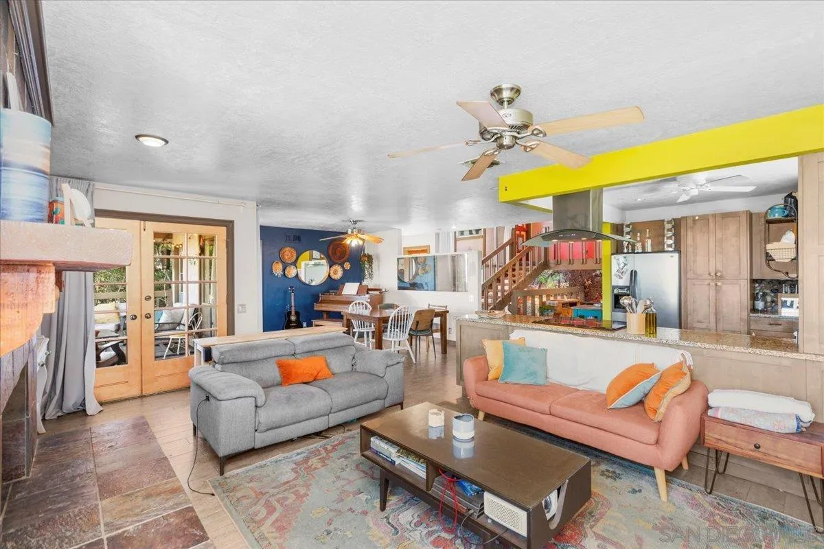 8621 Golf Drive Spring Valley, CA 91977 - Photo 16 of 41 a living room with patio furniture and a chandelier