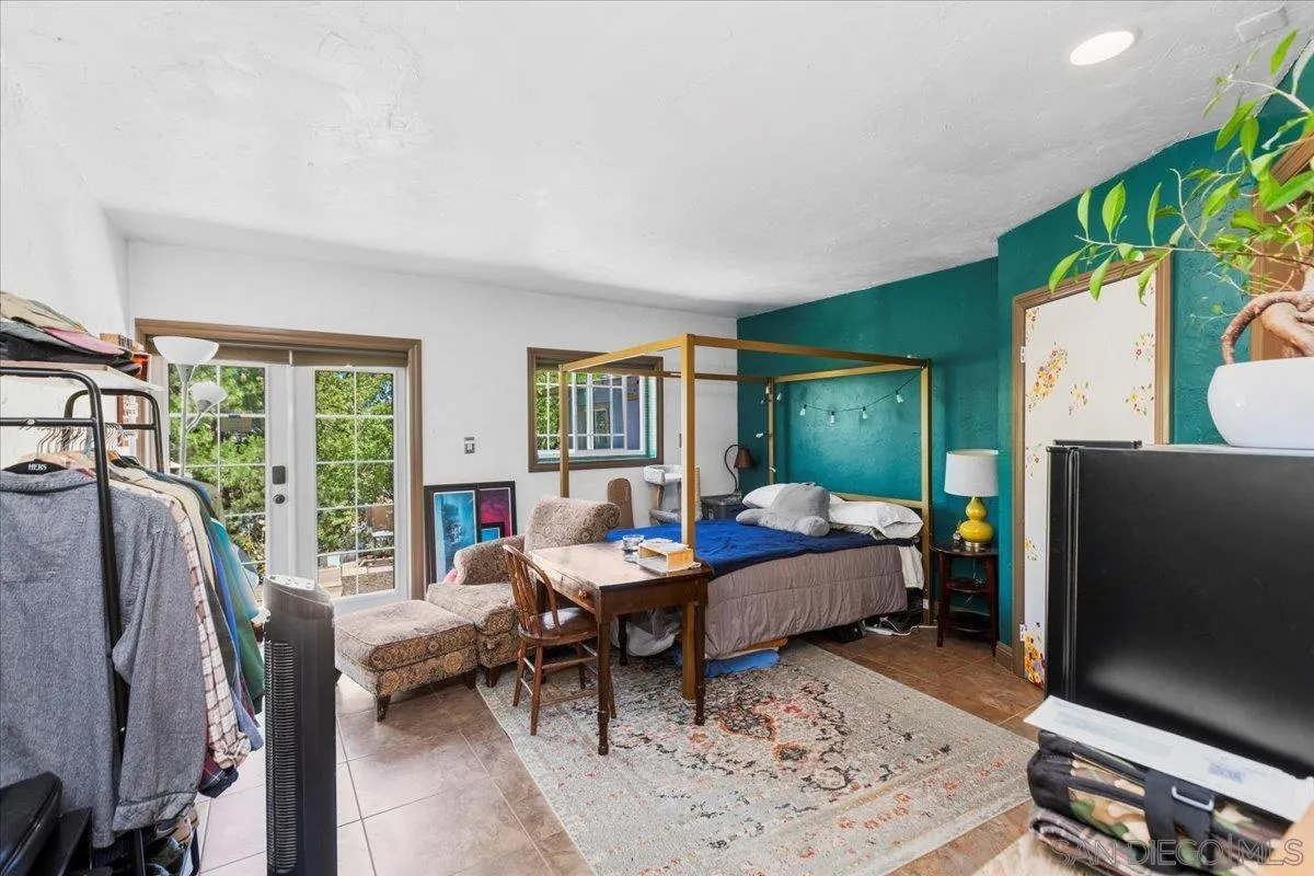 8621 Golf Drive Spring Valley, CA 91977 - Photo 23 of 41 a living room with furniture and a flat screen tv