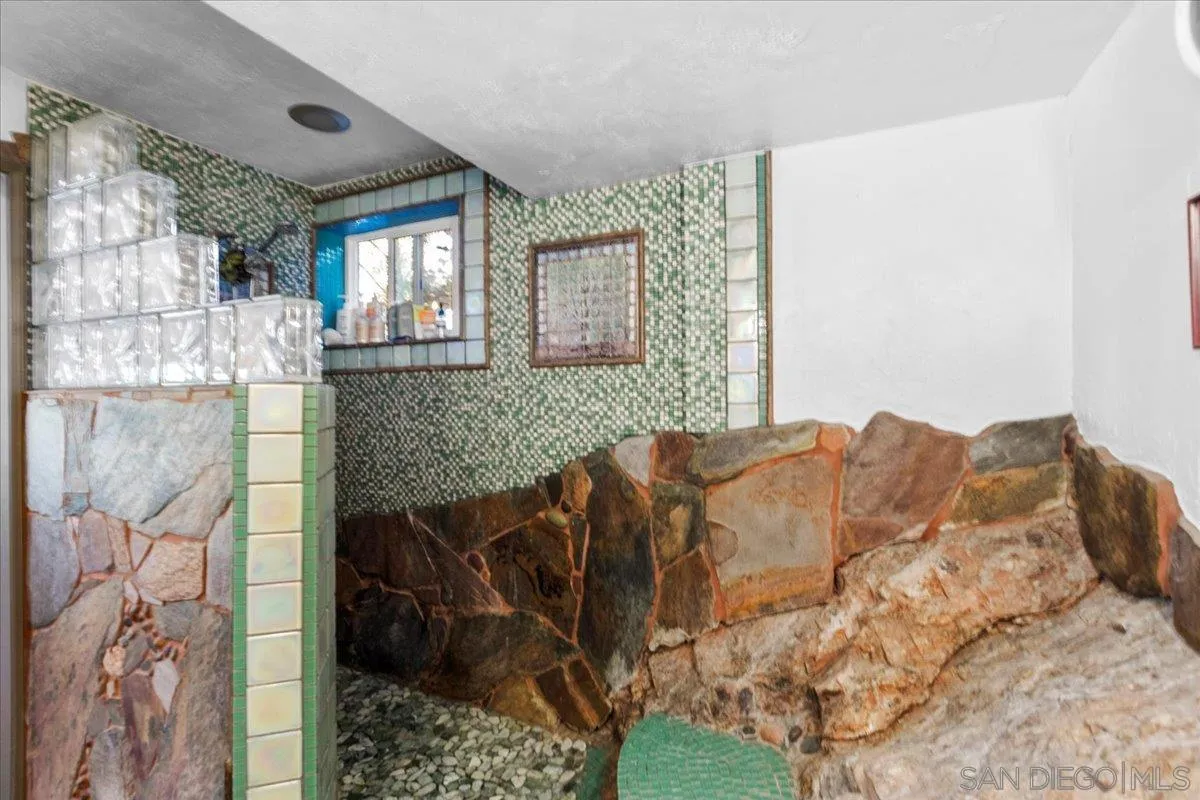 8621 Golf Drive Spring Valley, CA 91977 - Photo 25 of 41 a living room with a couch and a chandelier