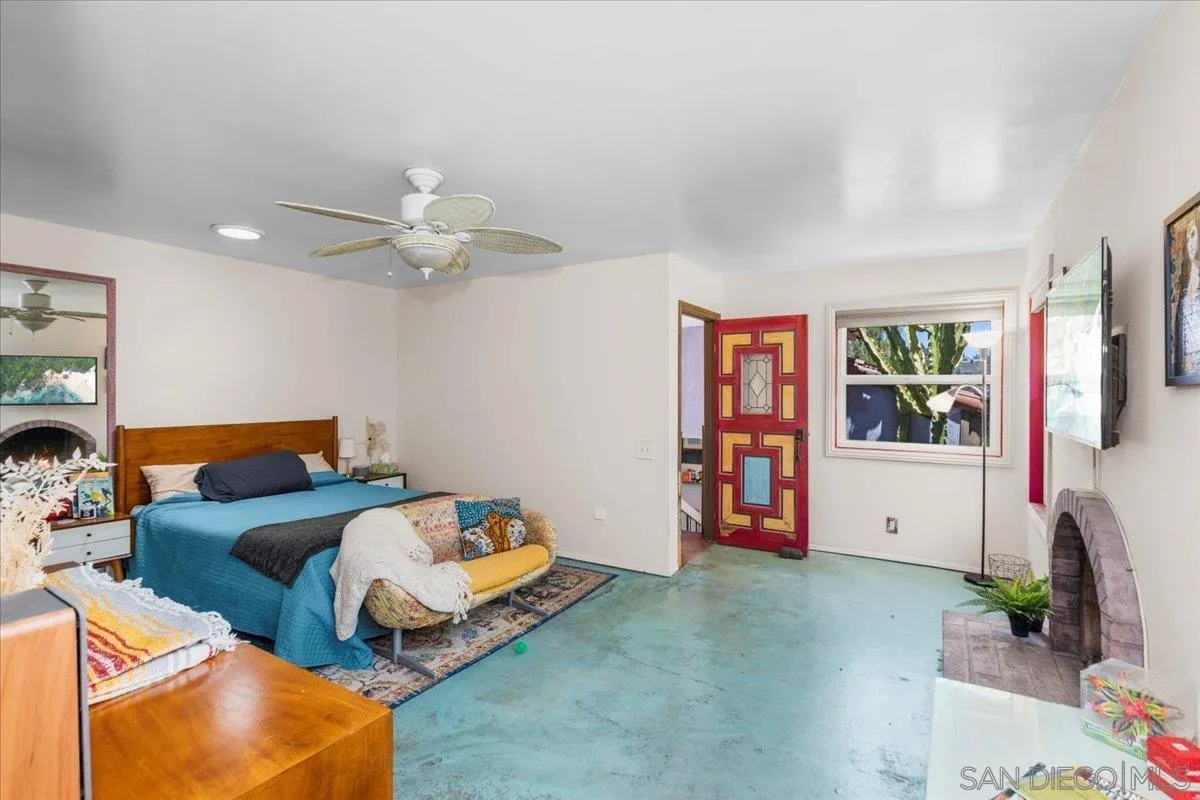 8621 Golf Drive Spring Valley, CA 91977 - Photo 33 of 41 a bedroom with furniture and a large window