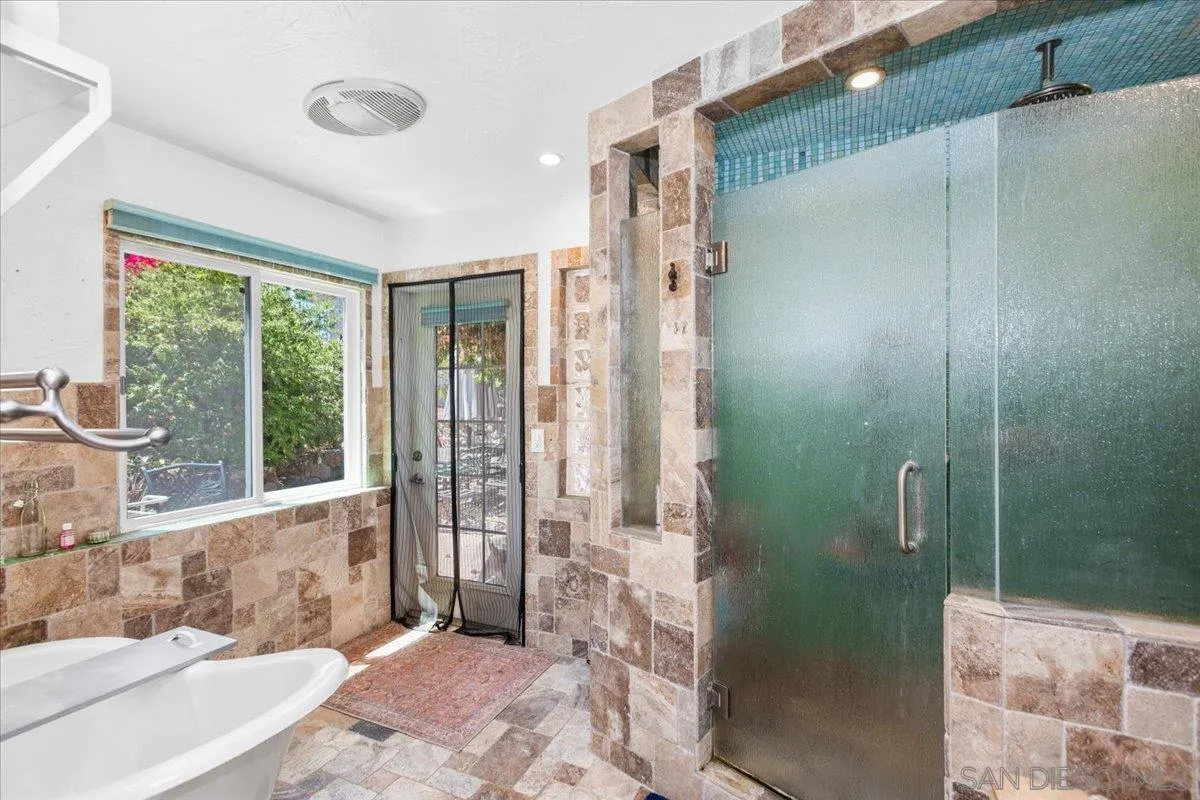 8621 Golf Drive Spring Valley, CA 91977 - Photo 35 of 41 a bathroom with a bathtub and shower