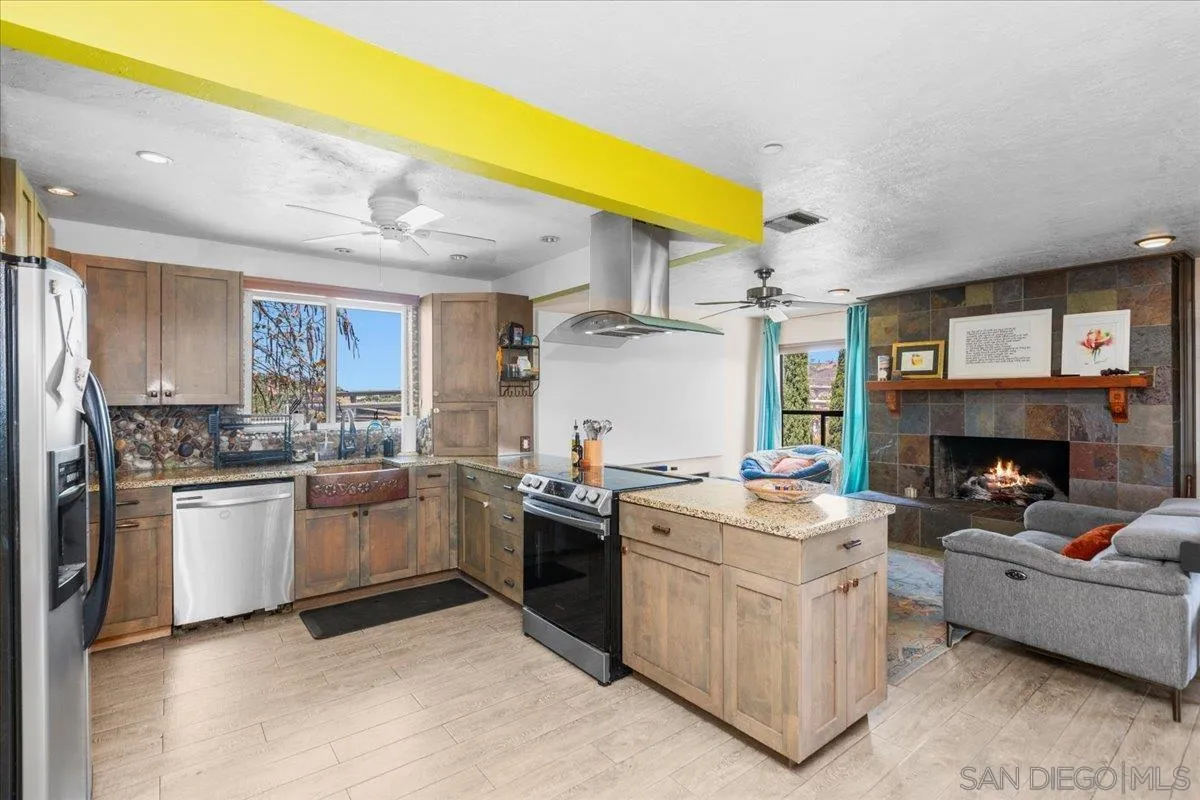 8621 Golf Drive Spring Valley, CA 91977 - Photo 8 of 41 a kitchen with stove and white cabinets