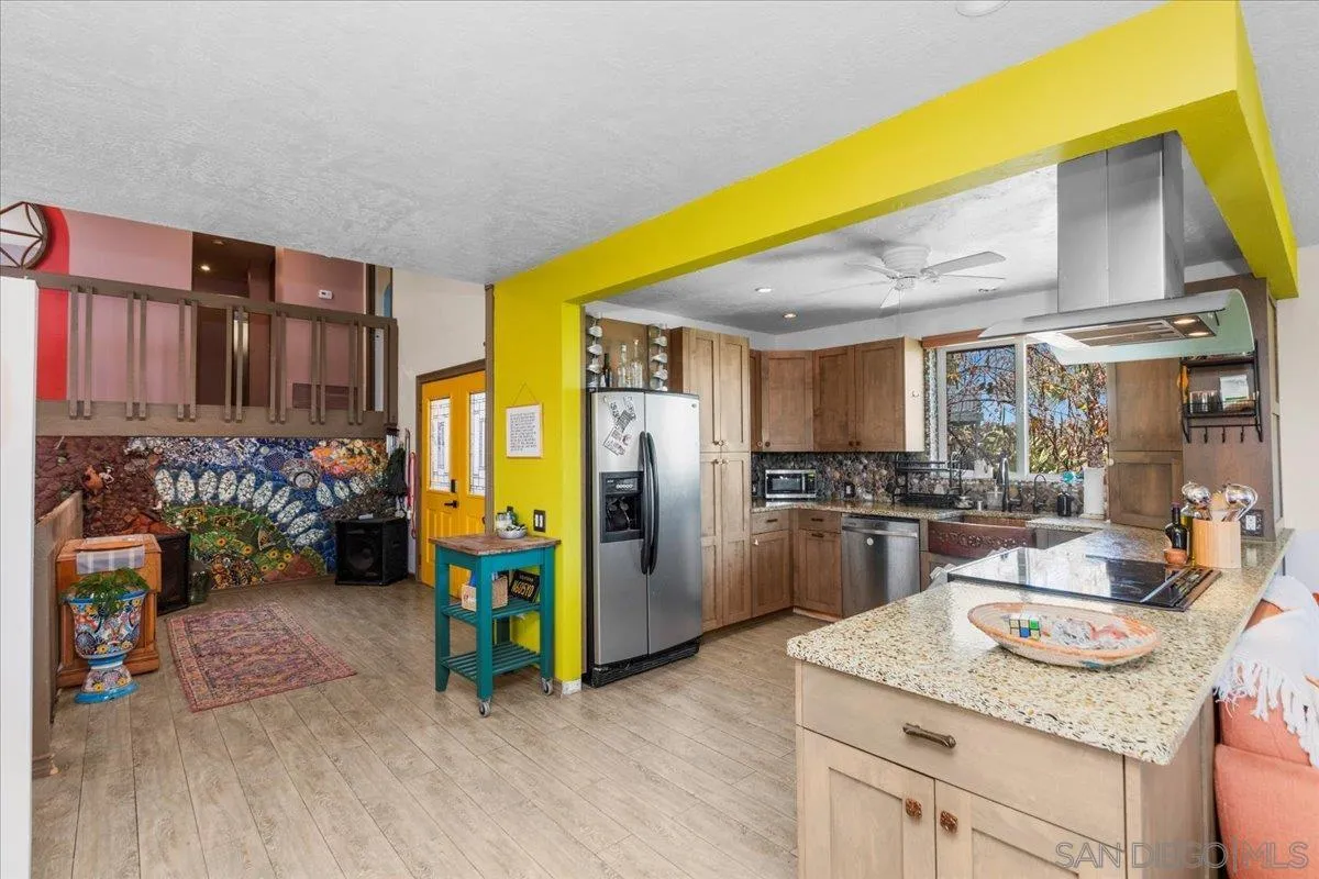 8621 Golf Drive Spring Valley, CA 91977 - Photo 9 of 41 a kitchen with refrigerator and stove