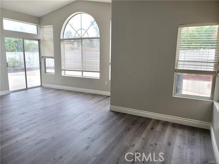 45617 Corte Montril Temecula, CA 92592 - Photo 2 of 50 an empty room with wooden floor and windows