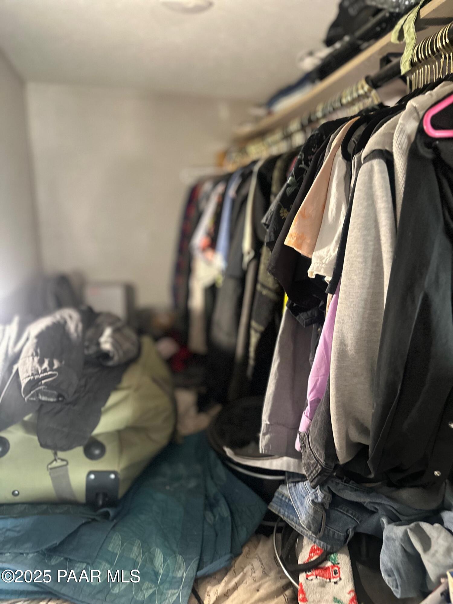0 Triple H Ranch Road Ash Fork, AZ 86320 - Photo 11 of 46 a view of walk in closet with clothes and shoes