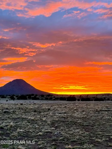 a view of lawn chairs and umbrella