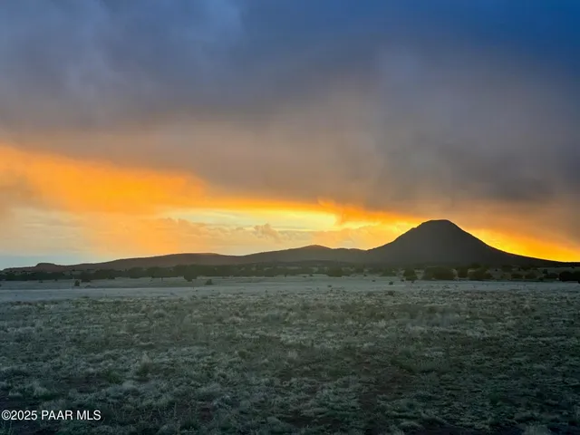 a view of ocean with sunset