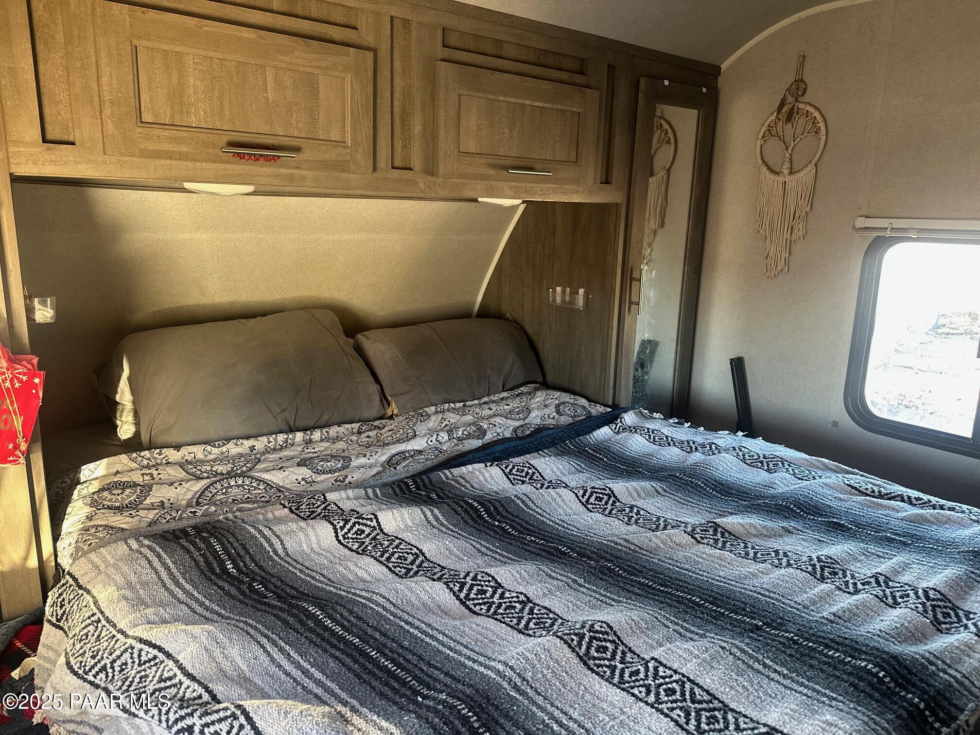 0 Triple H Ranch Road Ash Fork, AZ 86320 - Photo 6 of 46 a bedroom with a bed and window