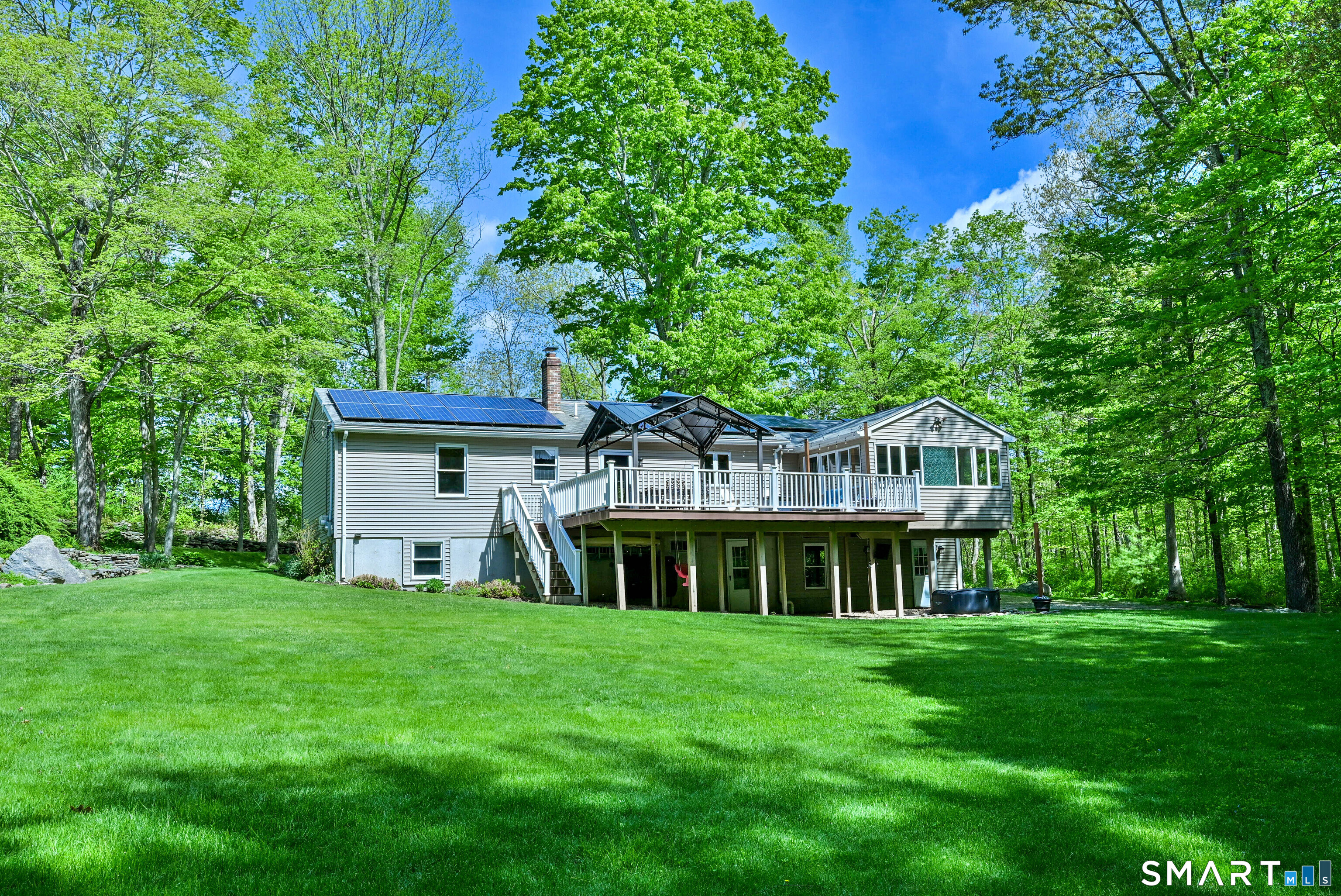 309 O'Leary Road Thompson, CT 06277 - Photo 4 of 40 a view of an house with backyard porch and sitting area