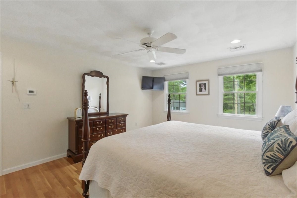 8 Valley Road Danvers, MA 01923 - Photo 24 of 41 a bedroom with a bed and a dresser