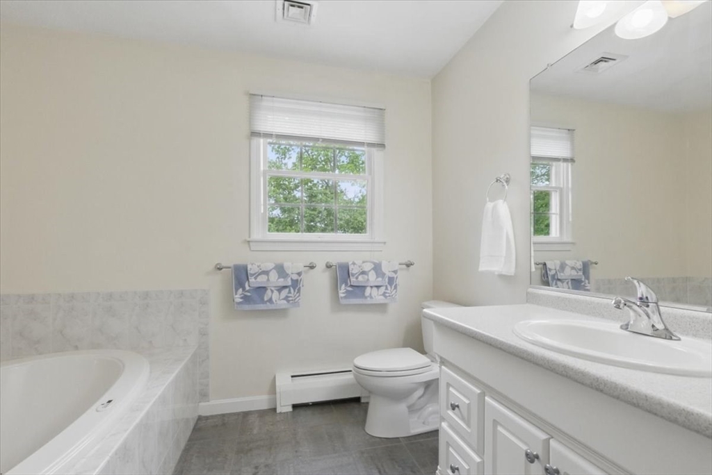 8 Valley Road Danvers, MA 01923 - Photo 25 of 41 a bathroom with a sink a toilet and bathtub