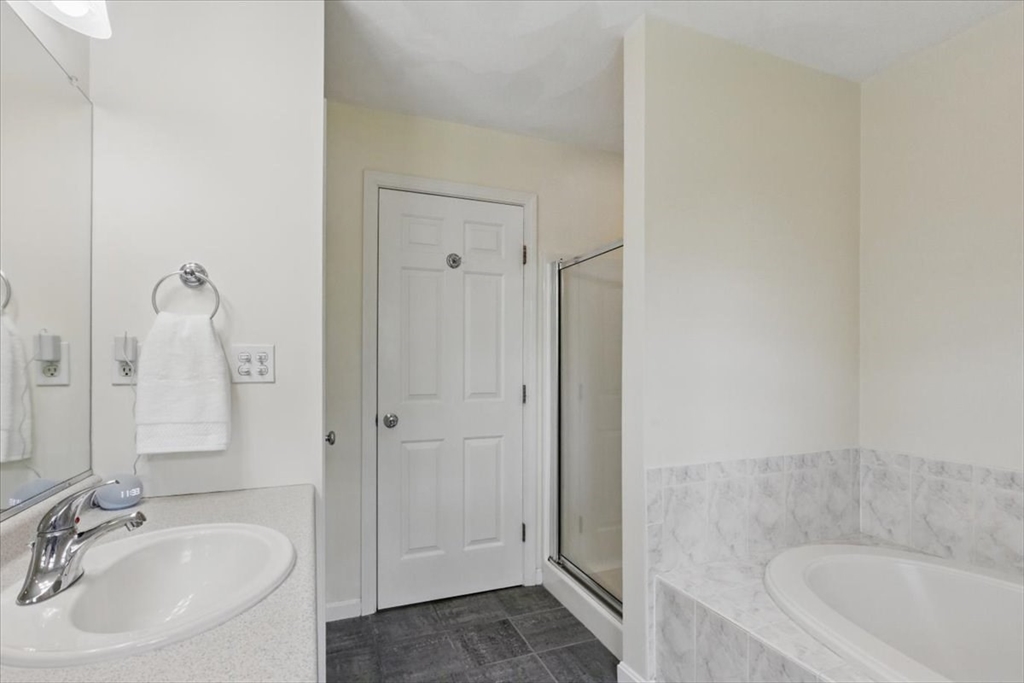 8 Valley Road Danvers, MA 01923 - Photo 26 of 41 a bathroom with a sink and a tub