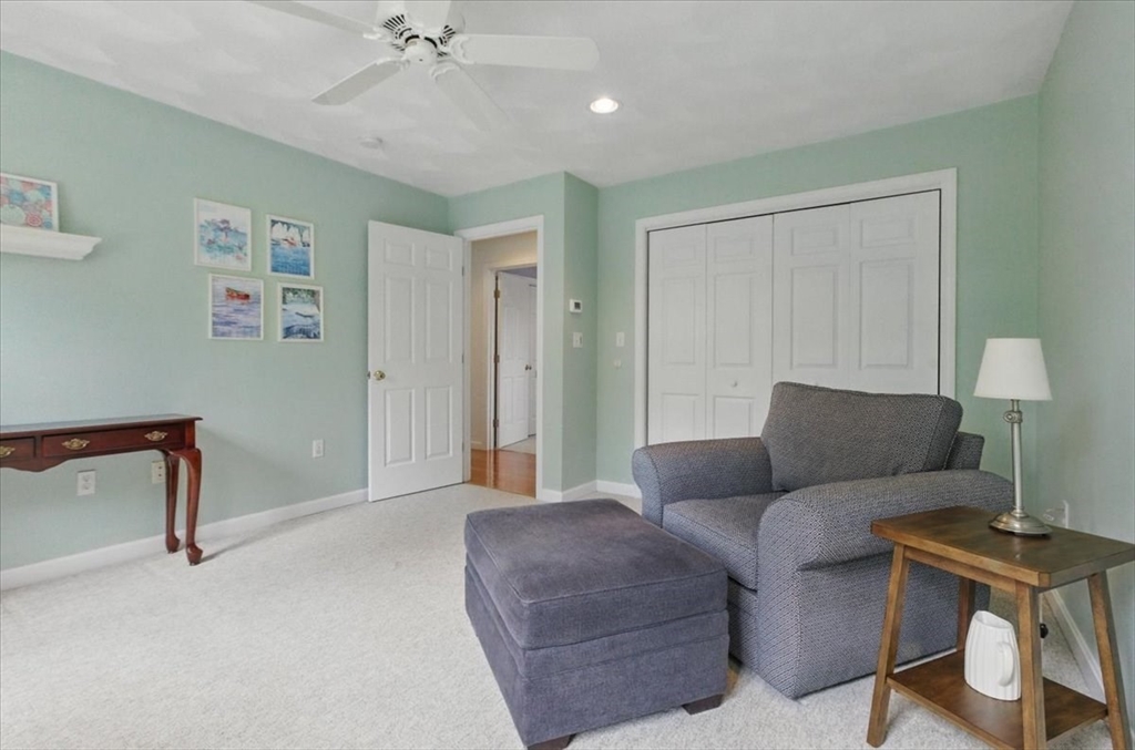 8 Valley Road Danvers, MA 01923 - Photo 29 of 41 a living room with furniture and a lamp