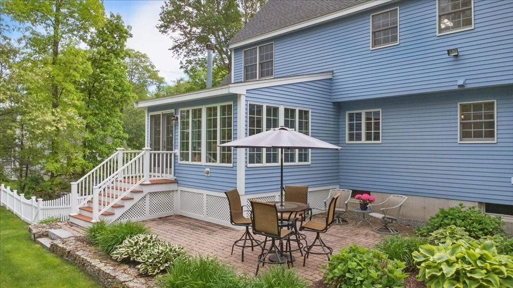 8 Valley Road Danvers, MA 01923 - Photo 5 of 41 a front view of a house with patio and garden