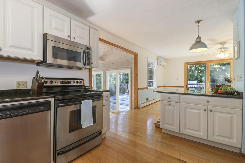 2 Samoset Road Mashpee, MA 02649 - Photo 12 of 41 a kitchen with stainless steel appliances granite countertop a stove and a wooden floors