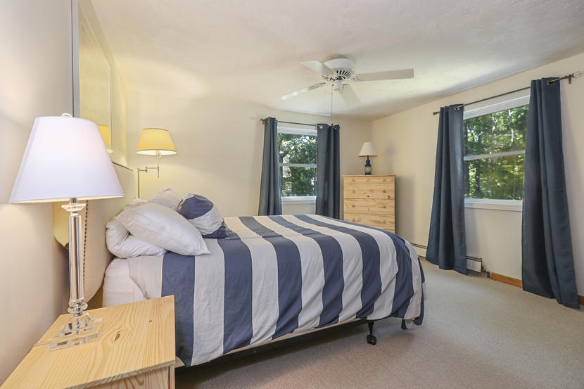 2 Samoset Road Mashpee, MA 02649 - Photo 24 of 41 a bed room with a bed and a lamp