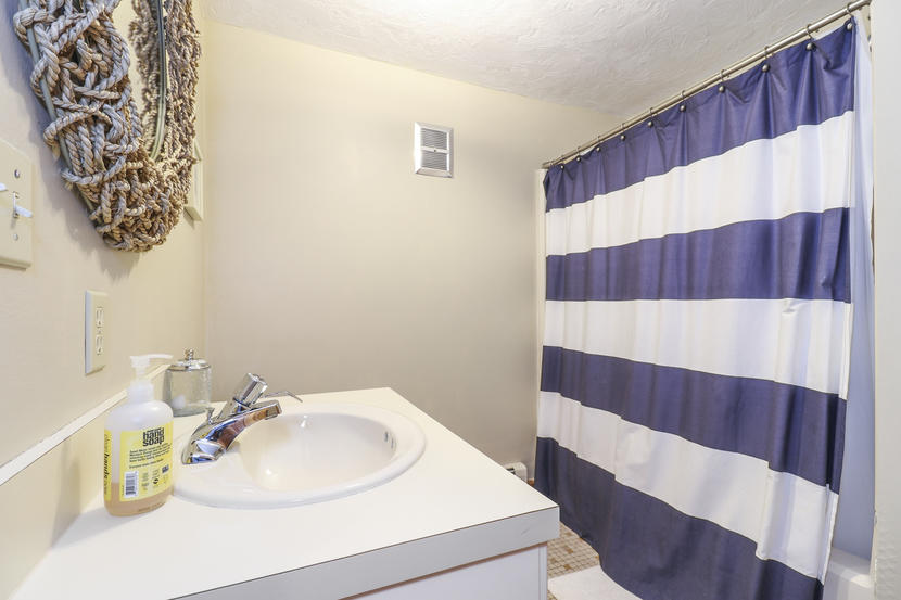 2 Samoset Road Mashpee, MA 02649 - Photo 27 of 41 a bathroom with a sink and a mirror