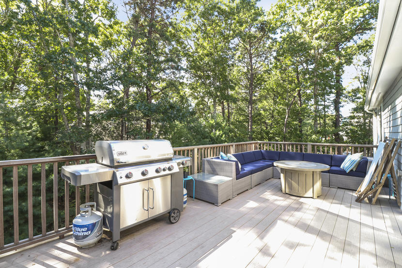 2 Samoset Road Mashpee, MA 02649 - Photo 28 of 41 a view of a patio with a table and chairs