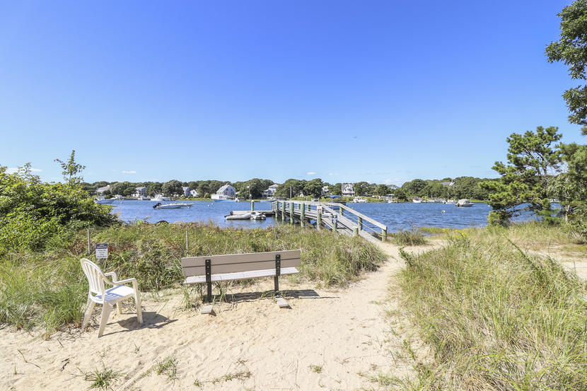 2 Samoset Road Mashpee, MA 02649 - Photo 38 of 41 a view of a lake with houses in the back