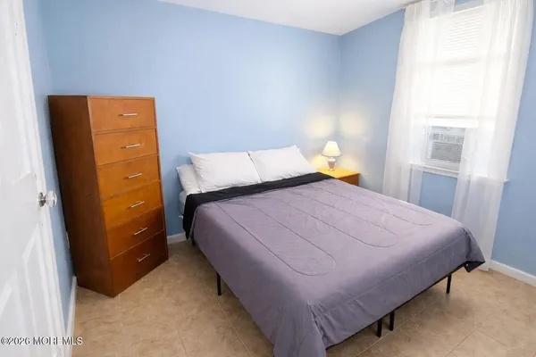a bedroom with a bed and a closet