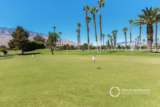 a view of a golf course with a lake
