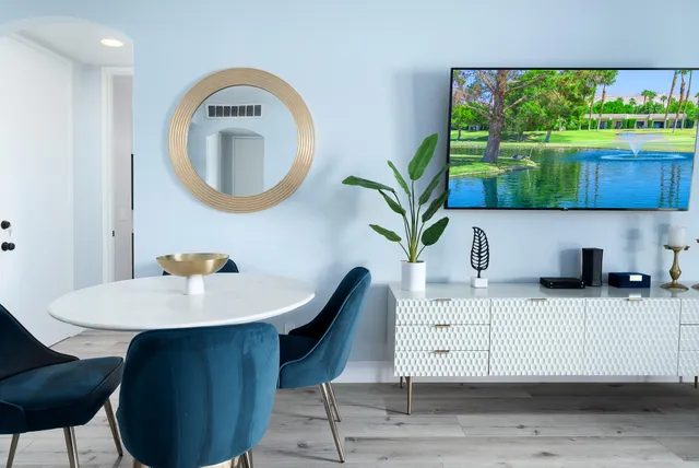 a workspace with a table and a potted plant