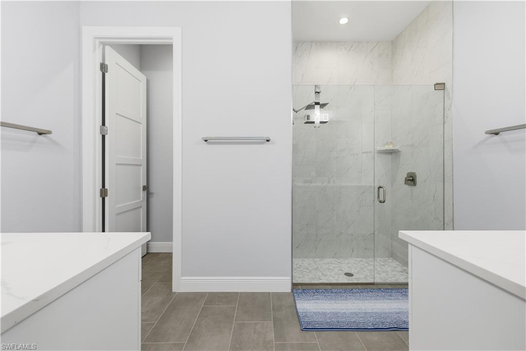 711 91st Avenue North Naples, FL 34108 - Photo 12 of 27 a bathroom with a shower