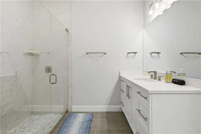 a view of bathroom with dual sinks