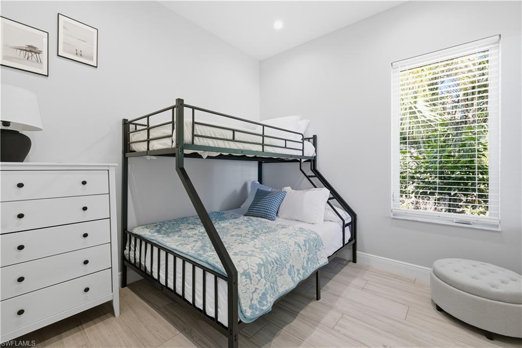 711 91st Avenue North Naples, FL 34108 - Photo 19 of 27 a bedroom with a bed and a window
