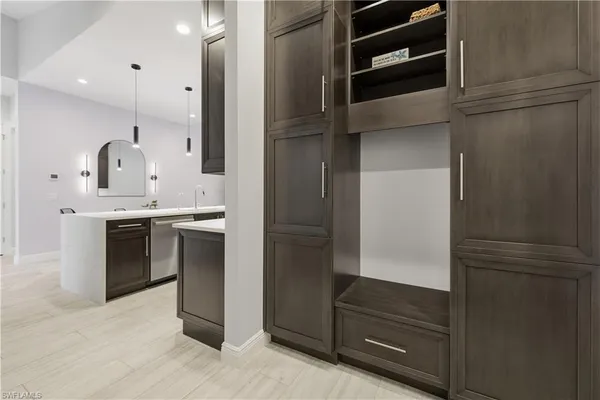a kitchen with a refrigerator and a sink