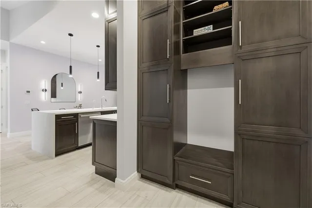 a kitchen with a refrigerator and a sink