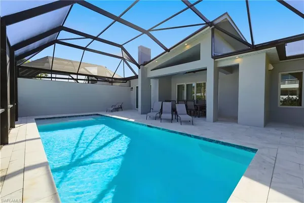 a view of swimming pool with a patio