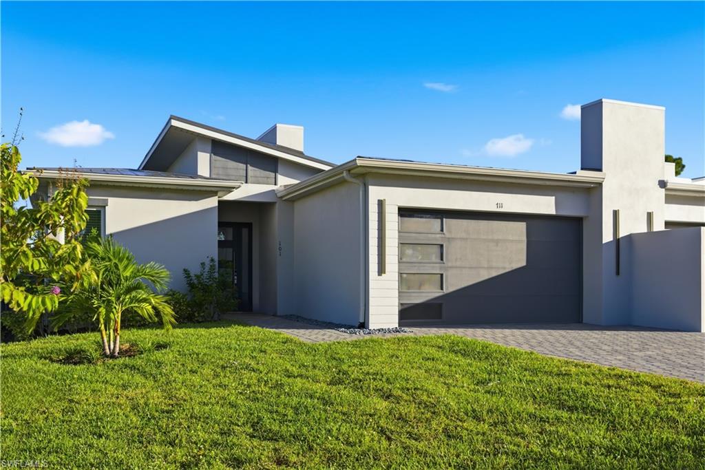 711 91st Avenue North Naples, FL 34108 - Photo 26 of 27 a backyard of a house with lots of green space
