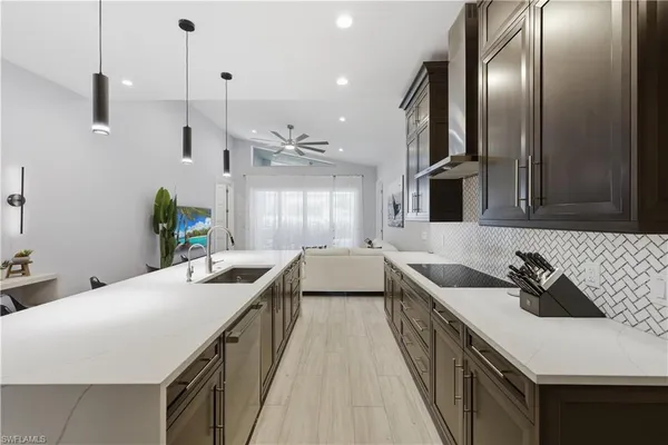 a kitchen with a sink stove and cabinets