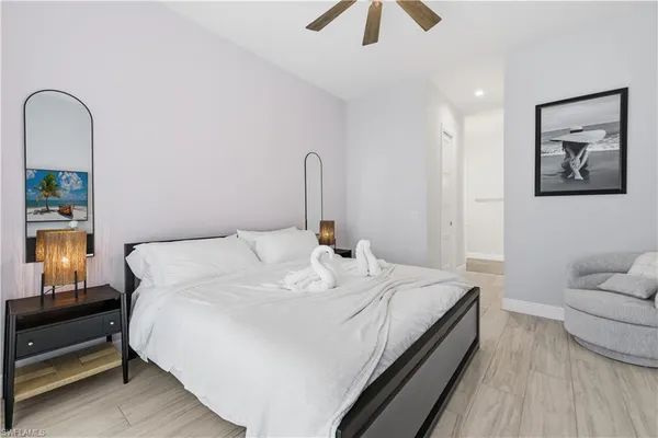 a large white bed in a white room