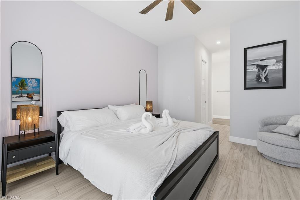 711 91st Avenue North Naples, FL 34108 - Photo 8 of 27 a large white bed in a white room