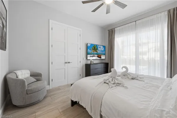 a bedroom with a bed and a couch