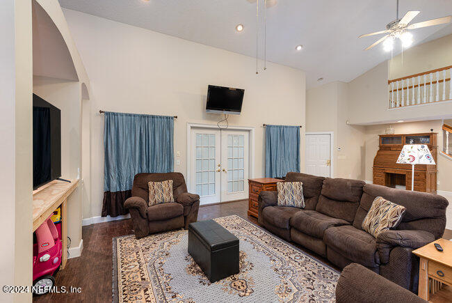 8092 Collins Road Jacksonville, FL 32244 - Photo 15 of 42 a living room with furniture window and flat screen tv