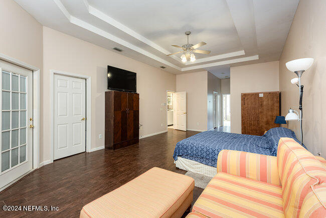 8092 Collins Road Jacksonville, FL 32244 - Photo 18 of 42 a living room with furniture and a flat screen tv