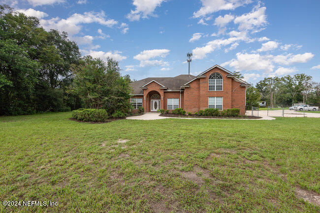 8092 Collins Road Jacksonville, FL 32244 - Photo 2 of 42 a front view of a house with garden