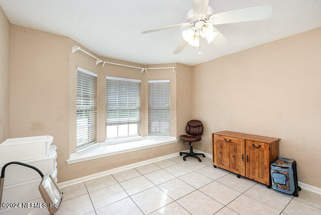 8092 Collins Road Jacksonville, FL 32244 - Photo 22 of 42 a living room with furniture and a window