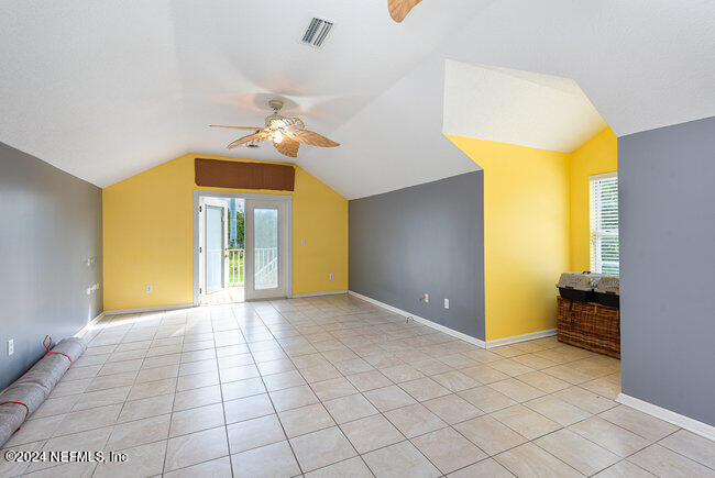 8092 Collins Road Jacksonville, FL 32244 - Photo 24 of 42 a view of a room with a chandelier fan and windows