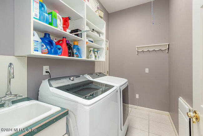 8092 Collins Road Jacksonville, FL 32244 - Photo 30 of 42 a utility room with dryer and washer