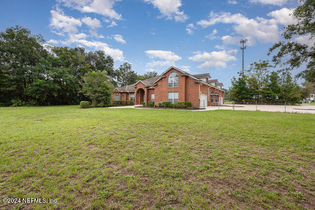 8092 Collins Road Jacksonville, FL 32244 - Photo 3 of 42 a view of a house with a yard