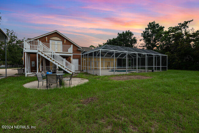 8092 Collins Road Jacksonville, FL 32244 - Photo 33 of 42 a front view of a house with a yard and trees