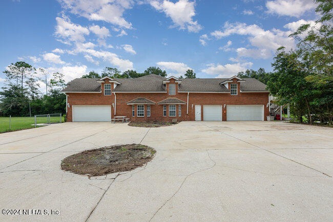 8092 Collins Road Jacksonville, FL 32244 - Photo 37 of 42 front view of a house with a dry yard