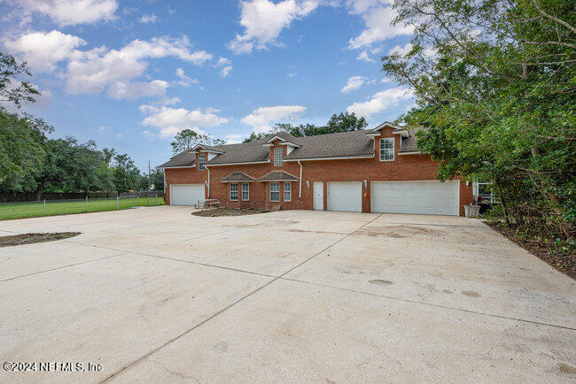 8092 Collins Road Jacksonville, FL 32244 - Photo 39 of 42 a house view with a backyard