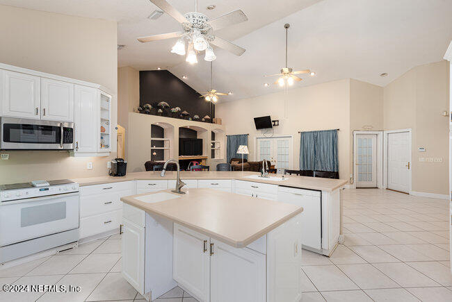 8092 Collins Road Jacksonville, FL 32244 - Photo 8 of 42 a kitchen with sink cabinets and stainless steel appliances