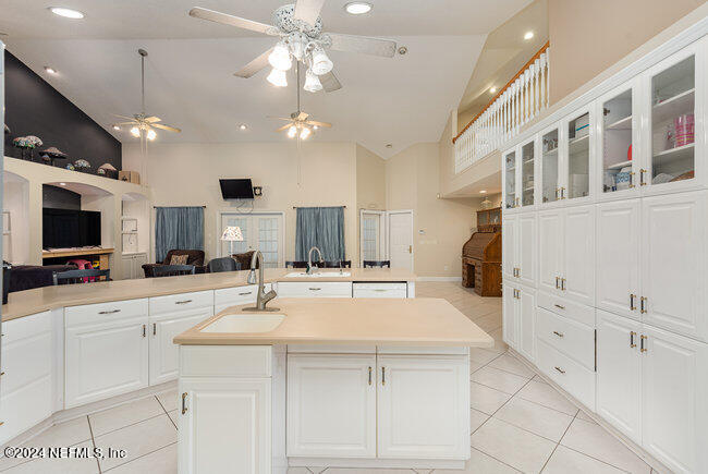 8092 Collins Road Jacksonville, FL 32244 - Photo 10 of 42 a kitchen with stainless steel appliances kitchen island granite countertop a sink and cabinets
