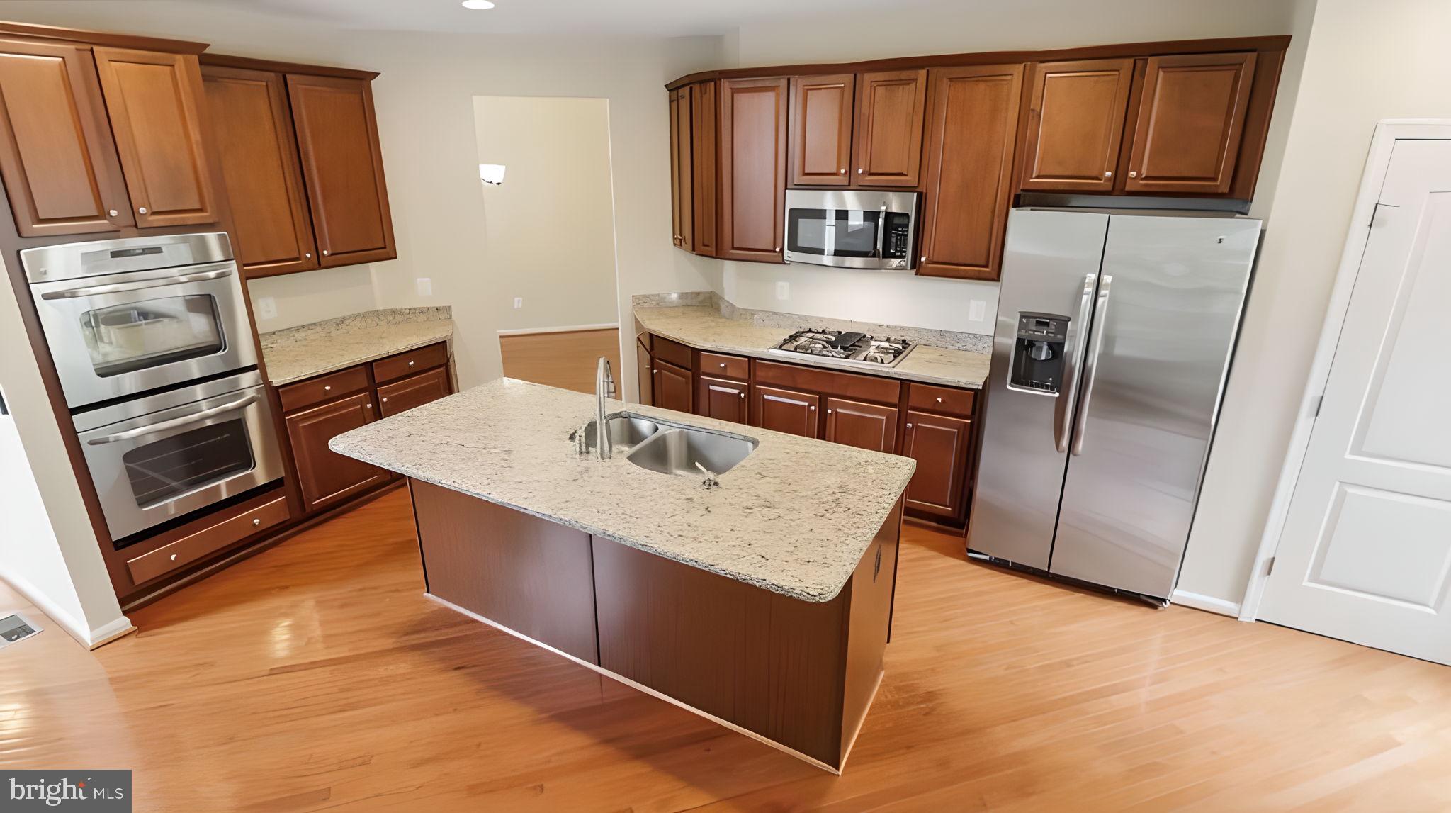 42371 Trellis Square Brambleton, VA 20148 - Photo 61 of 70 Modern kitchen with elegant finishes.